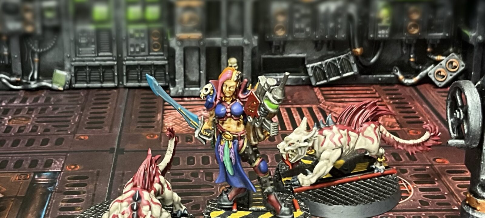 An escher gang queen and two phyrr cats modeled and posed in a tableau.