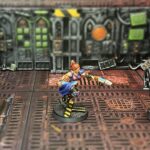 An Escher champion with a power sword and plasma pistol