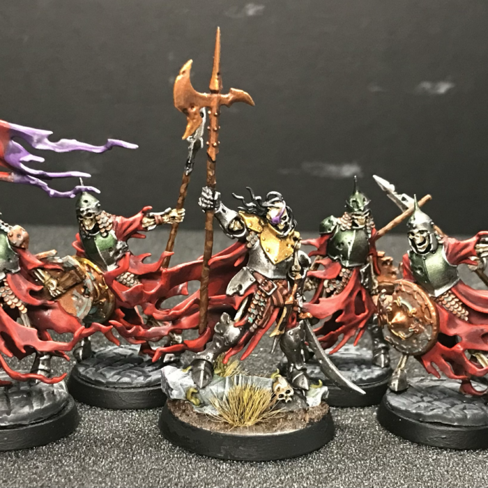 A group of skeleton miniatures lead by the Watch Captain Halgrim.