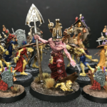 Gorslav the Gravekeeper and a collection of zombies on green stuff modeled bases.
