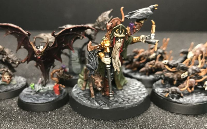 Torgillius the Chamberlain leads his bats and rats on green stuff modeled cobblestone bases.
