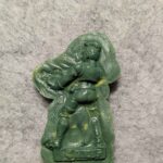 The back side of an old N95 Escher mini cast in green stuff.