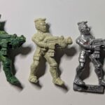 A mini cast in green stuff and Milliput versus the original.