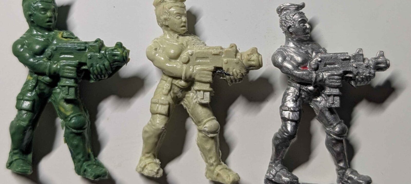 A mini cast in green stuff and Milliput versus the original.