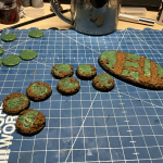 Ash Wastes bases made out of rolled green stuff and textured with old coffee and craft paint.