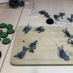 Cursed City bases with cobble stone green stuff base toppers and minis that have been pinned.