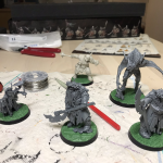 Cursed City miniatures mounted on their cobble stone base toppers.