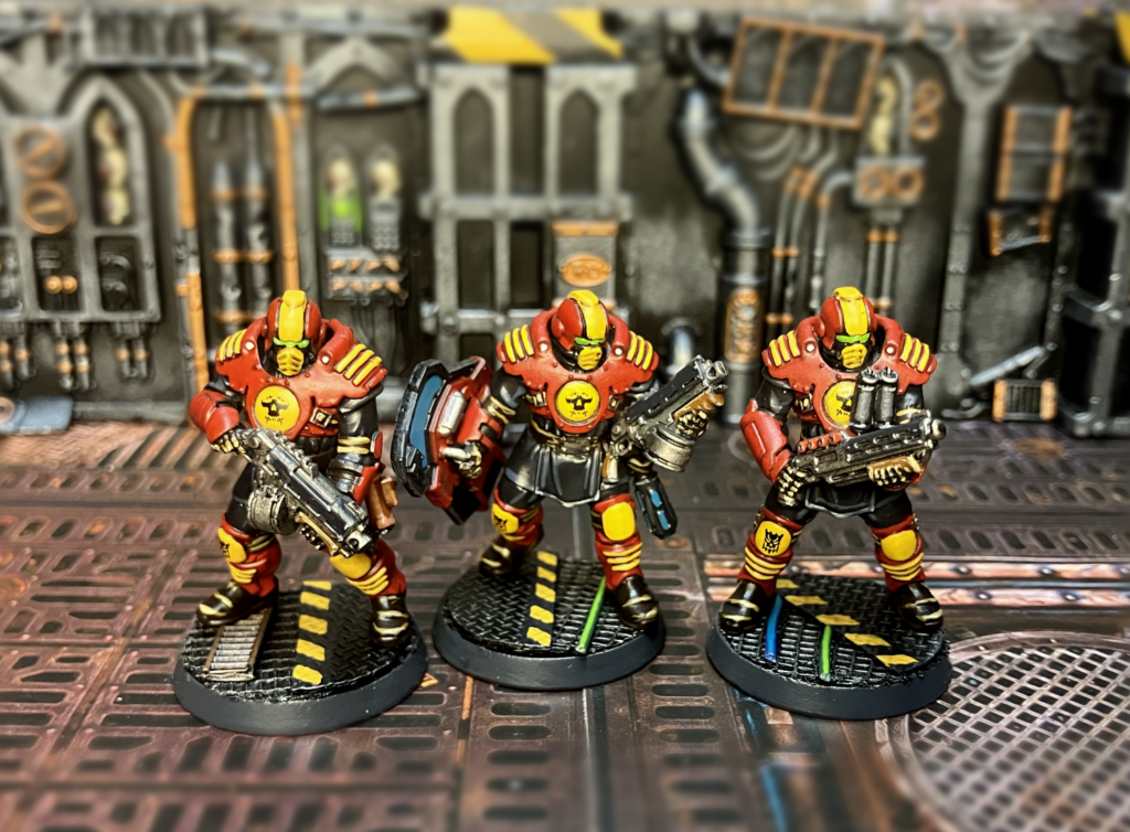 Two Palanite Enforcers with Boltguns, one with a shotgun.