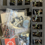 The necrons in foam and all the game pieces in bags, replacing the insert.