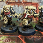 Space Marines painted in the paper beige livery of the Tome Keepers