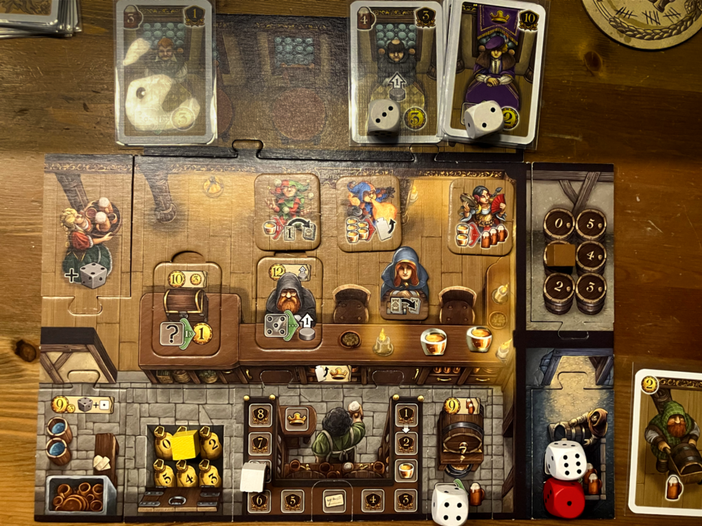 The Die Tavernen im Tiefen Thal player mat with the actions a player may make in their turn.