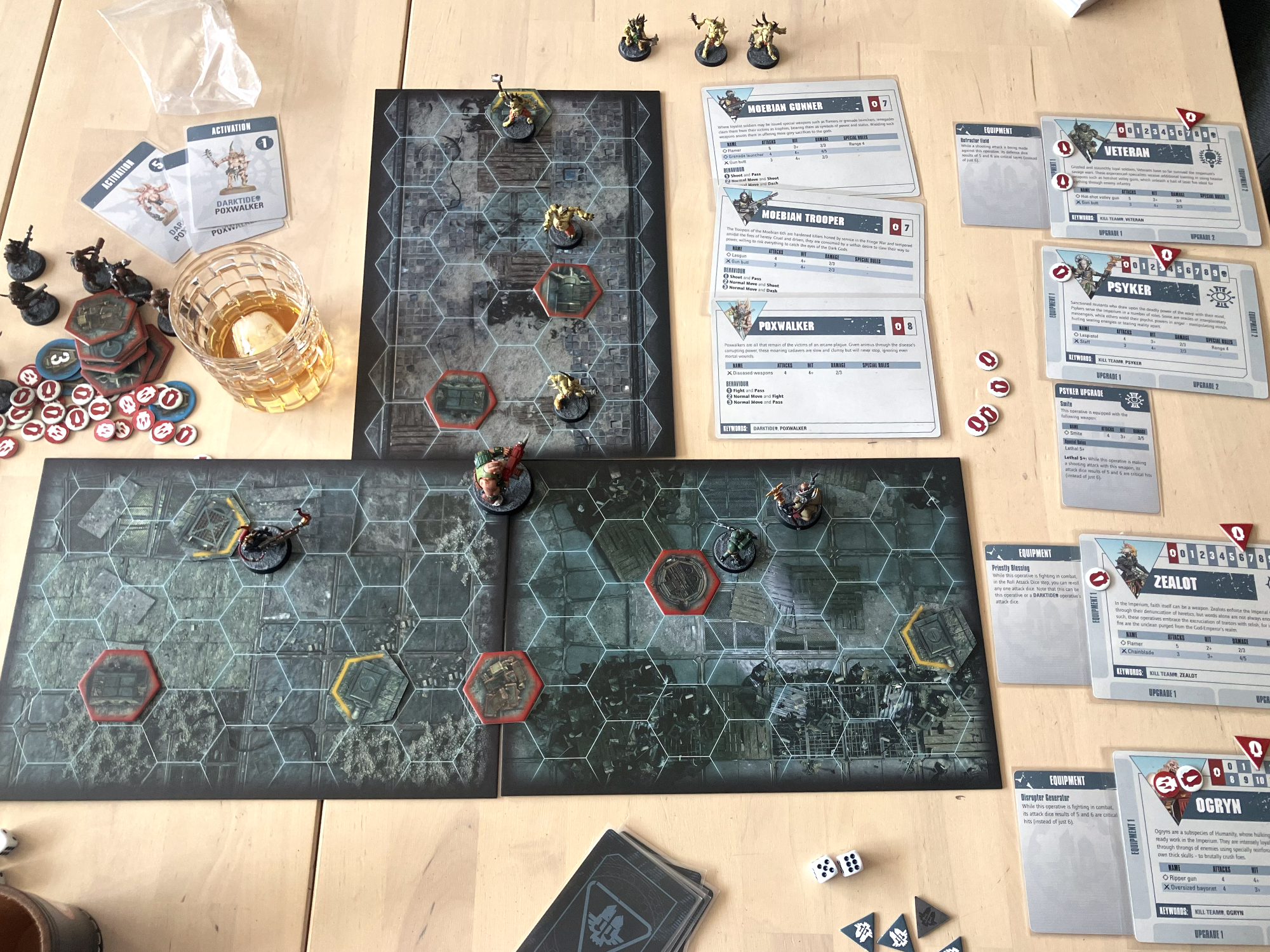 A Darktide game in progress with the necessary cards, dice, markers, miniatures, and bourbon