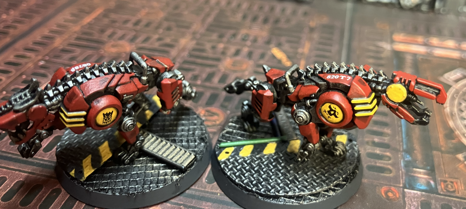 Two cyber-mastiffs with logos on their shoulders and serial number decals.