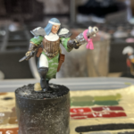 A juve for the new Roses of Saint Sydrena gang as seen from the side. A kitbashed Sororitas model being used as an Escher ganger.