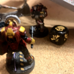 A murder dice is inflicted on an Orlock ganger by an Enforcer champ.