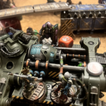 A Genestealer infected enforcer is murdered by two Escher sisters.