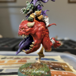 Madcap Miggz on his mount, from the left side, his arm holding tight.