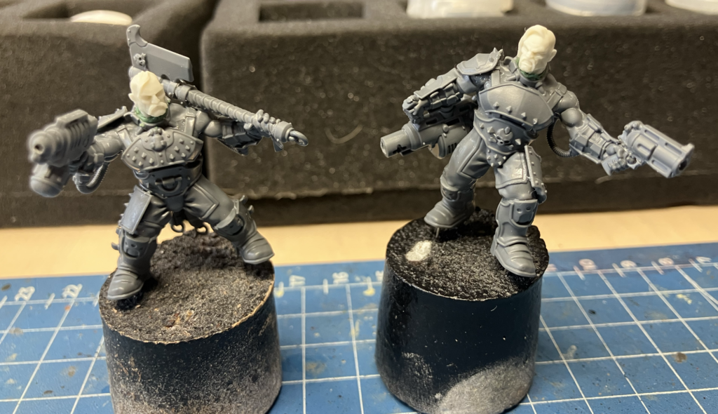 Two new Goliath models with head swaps, unpainted and mounted on corks.