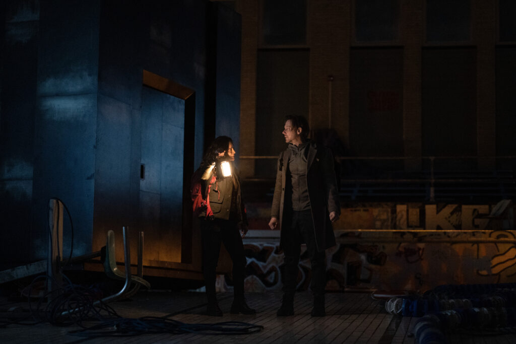 Ryan and Amanda in Dark Matter looking like they're about to go exploring the box.
