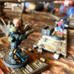 An outcast champion follows a hive scummer across a couple of platforms over the sump sea.