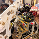 An outcast ambot comes to the hab, looking to help out.