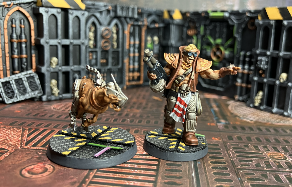An Orlock arms master with a combat shotgun and a cyber-mastiff