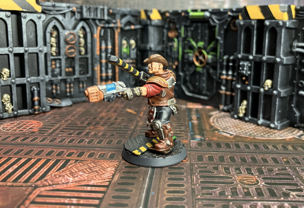 An Orlock leader with a plasma gun and a chainsword
