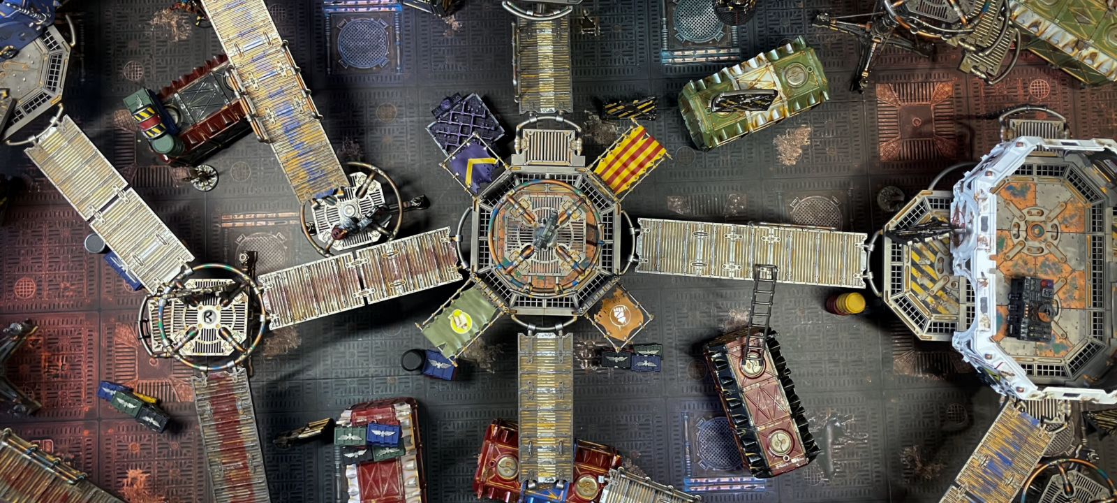 An underhive battlefield with a scenario generated from N26 cards.