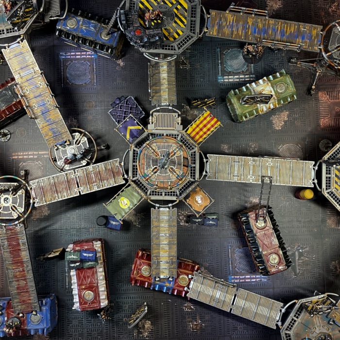 An underhive battlefield with a scenario generated from N26 cards.
