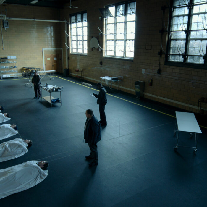 A still from Dark Matter, a line of bodies on the floor, all of them Jason or, at least, a version of Jason