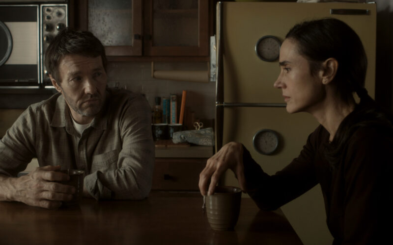 Jason and Daniella sit at their kitchen table in 1970's world in Dark Matter