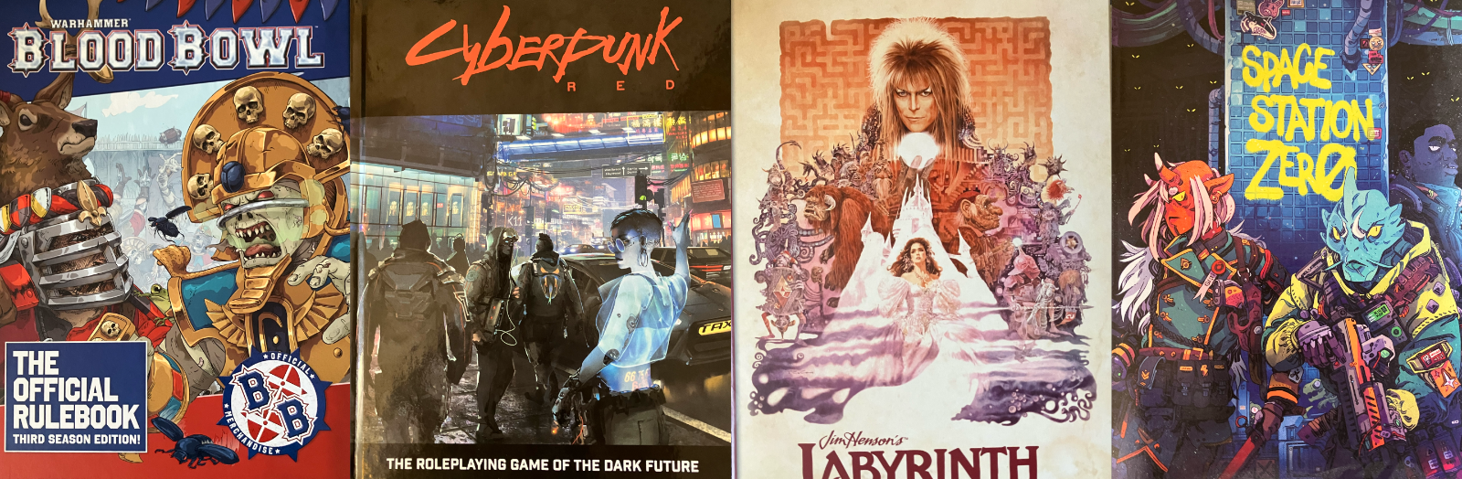 A collage of covers for The Hunt, Blood Bowl, Cyberpunk Red, Labyrinth, Space Station Zero, and Cyberpunk 2020