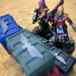 An Orlock Ganger and Juve hide behind cover in the Ash Wastes