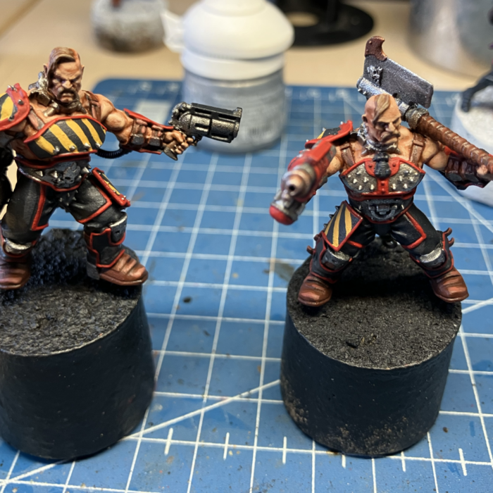 Two Goliath gangers, armed with a cleaver and flamer and a grenade launcher and stub gun