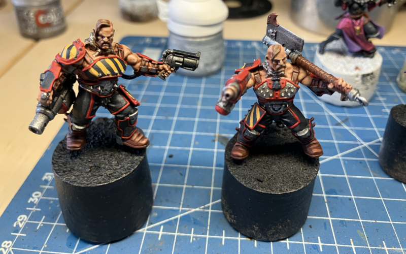 Two Goliath gangers, armed with a cleaver and flamer and a grenade launcher and stub gun