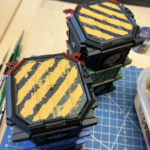 Two Munitorum Containers with the masking removed and rough result